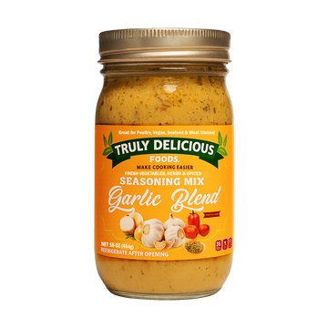 Jar of Truly Delicious Foods Garlic Blend seasoning mix on a white background